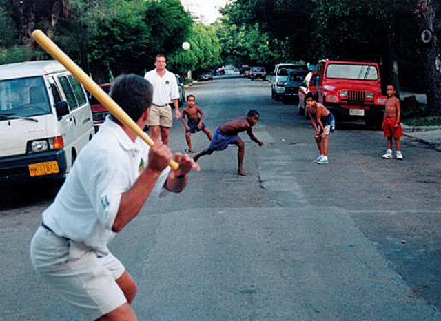 Playing whiffleball with the local kids